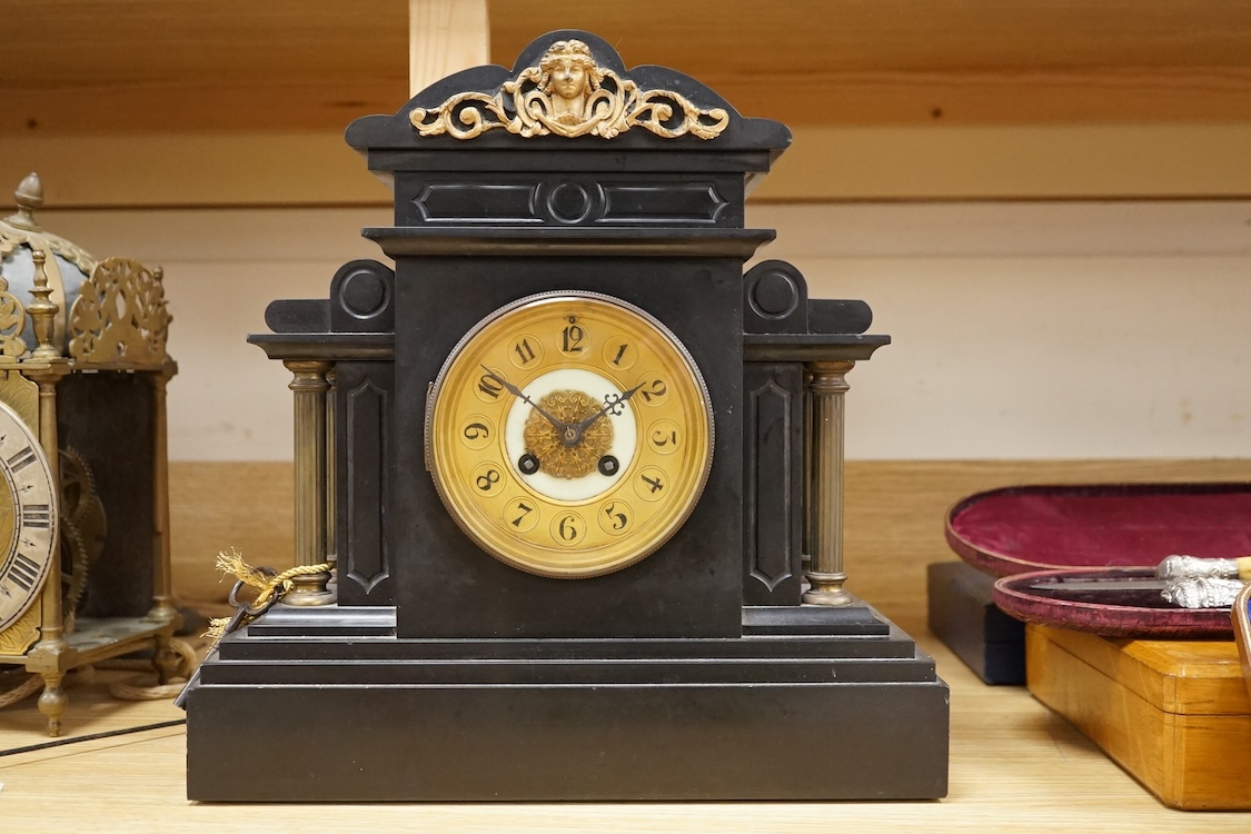 A black slate and gilt metal mounted mantel clock, 36cm high.